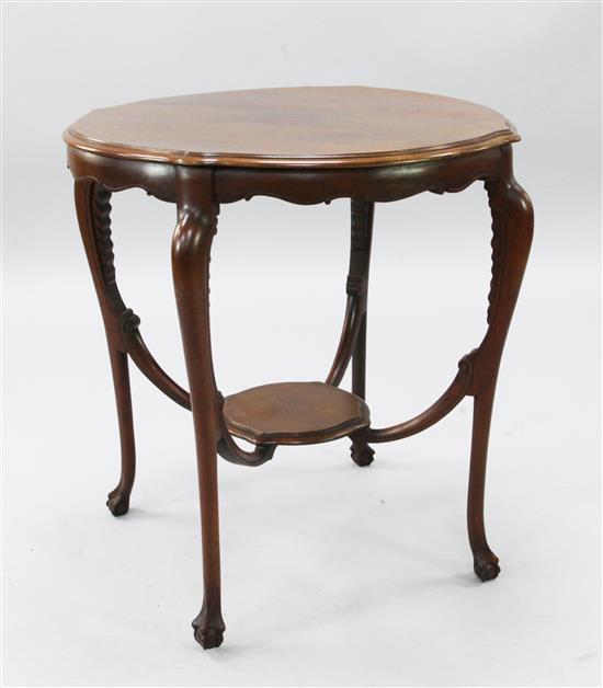 A late Victorian mahogany circular shaped topped two tier occasional table, diameter 2ft 4in.